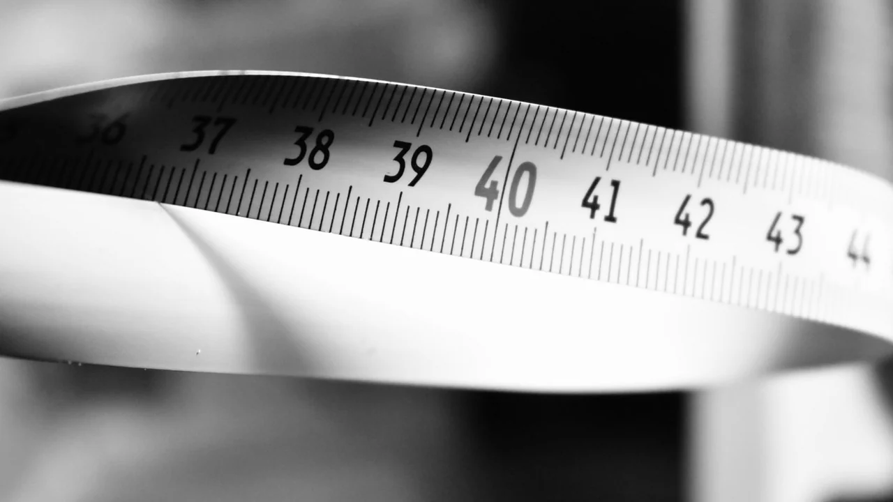 A close view of markings on a measuring tape